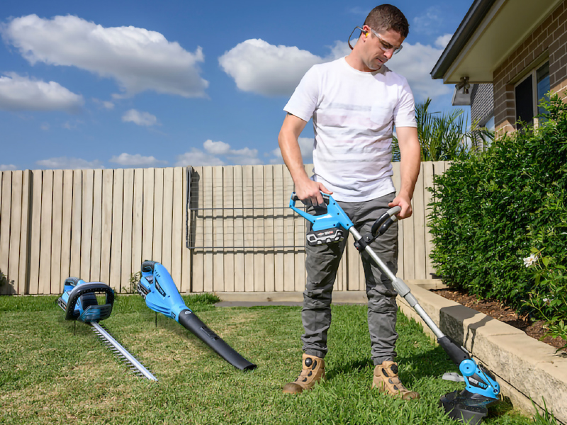 Dad using a line trimmer