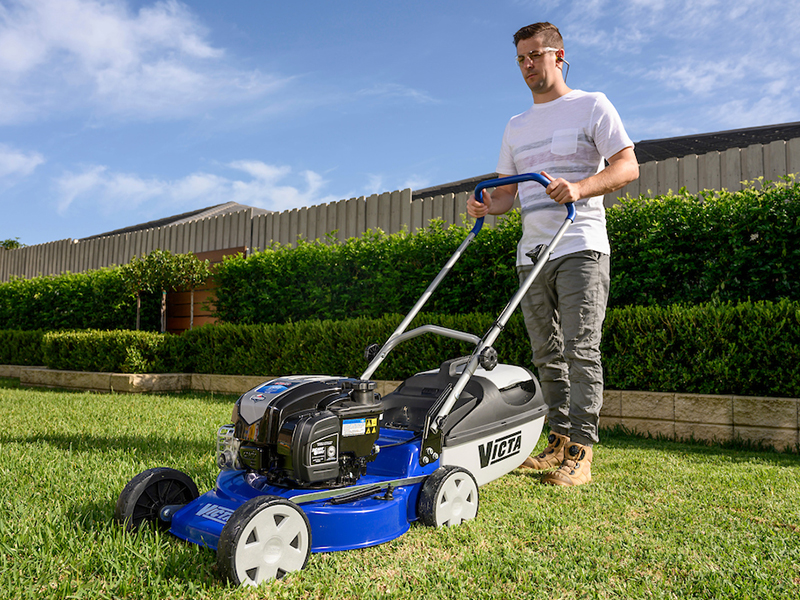 Dad pushing a Mulching Lawnmower